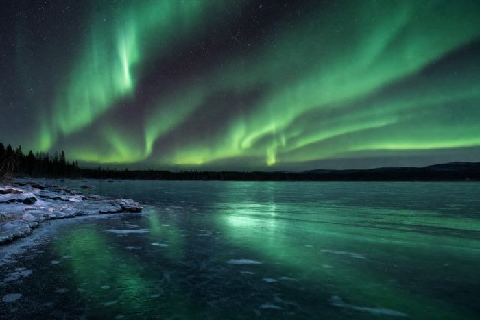 Aurora over a frozen lake